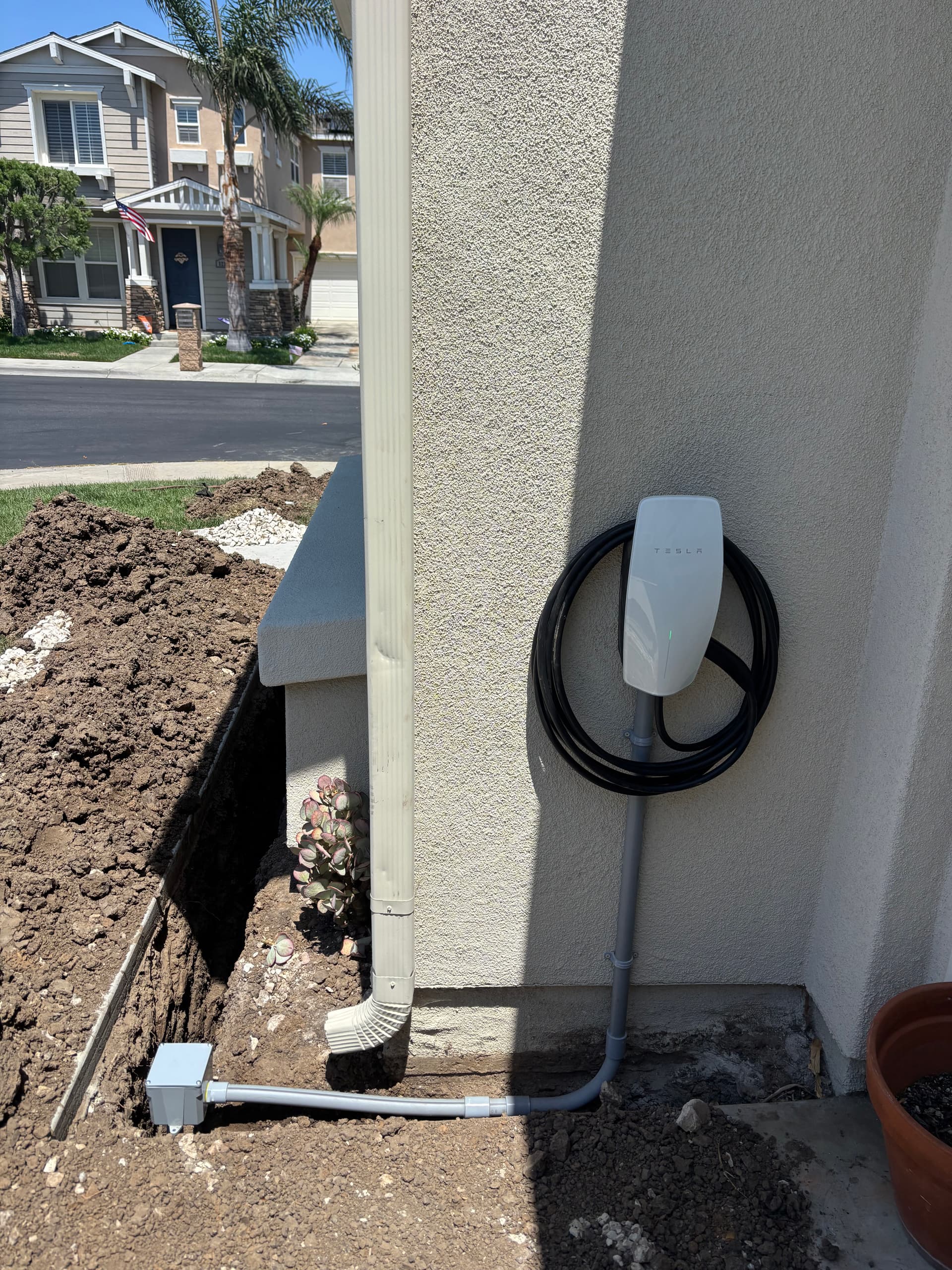 Tesla Universal Wall Connector Installed with Underground Electrical Feeders image