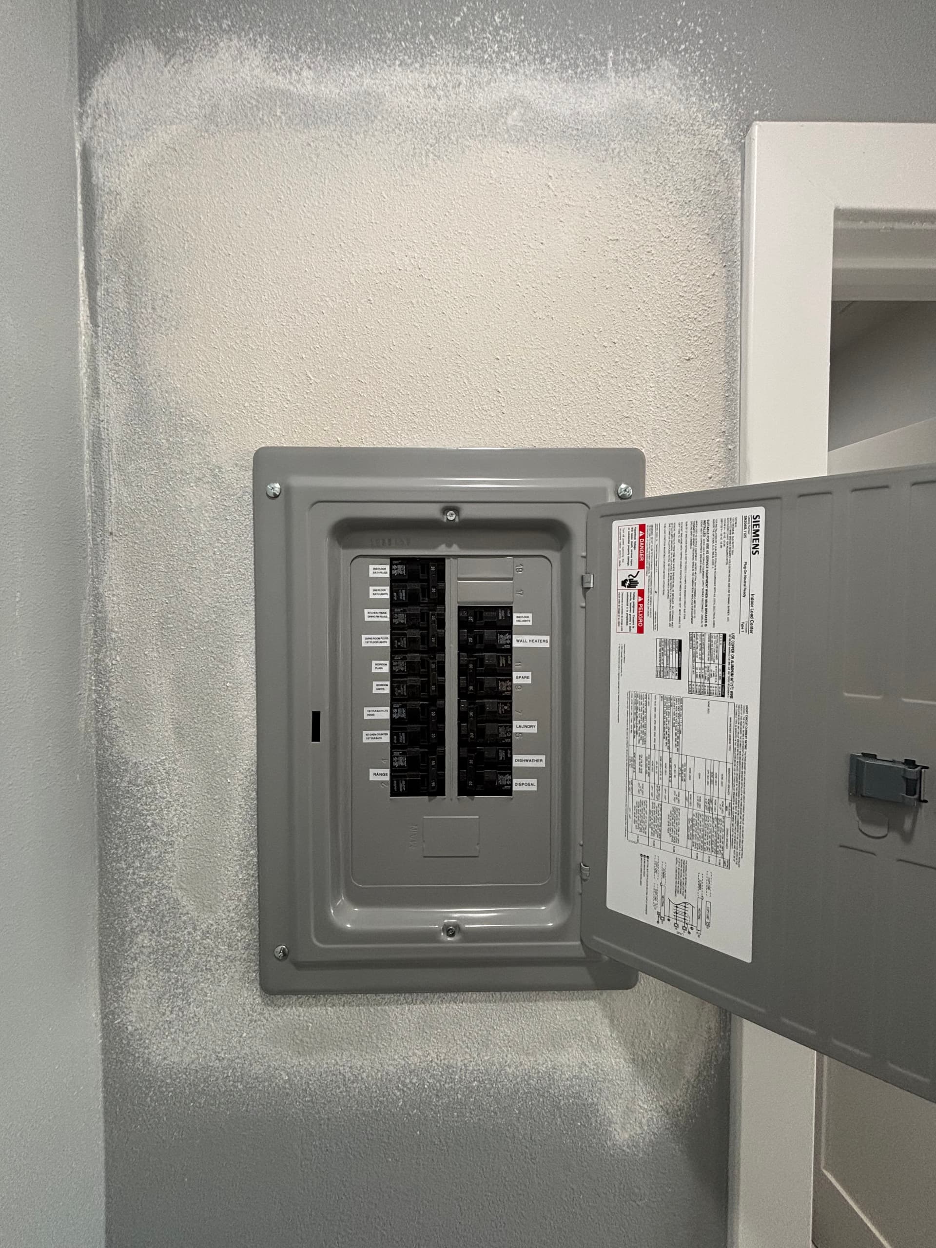 Old Electrical Panel Swapped Out for a Fresh Siemens Replacement image